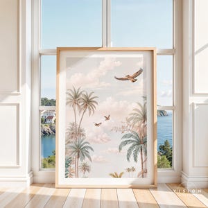 May include: A framed print of a tropical scene with palm trees and birds flying in a cloudy sky. The print has a soft, pastel color palette.