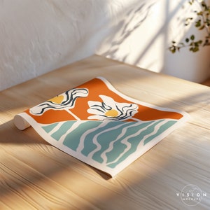 May include: A rolled up print with a stylized abstract floral design. The print features two white flowers with yellow centers on an orange background with blue and green wavy lines.