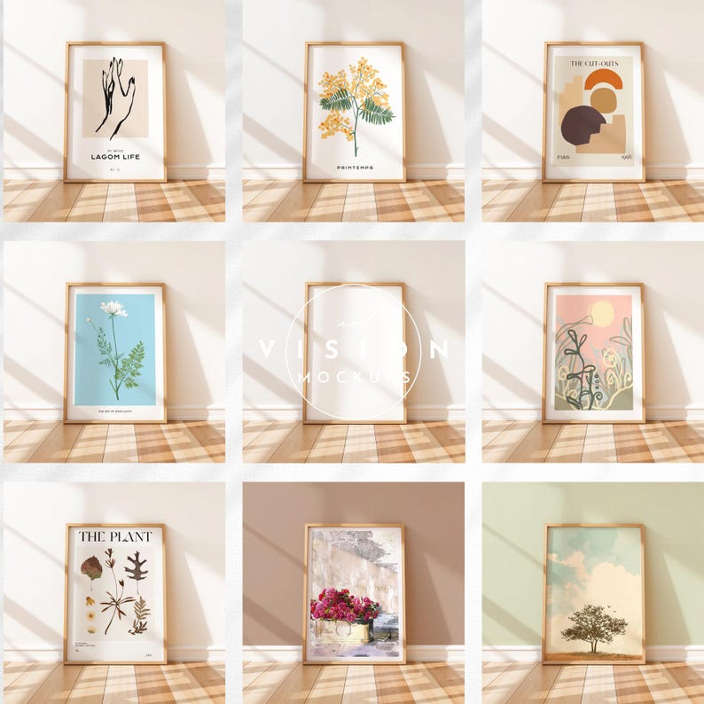 May include: Nine framed art prints with various botanical and abstract designs. The prints are displayed on a white wall with wooden floors. The prints include a hand drawing, a flower illustration, a geometric design, and a landscape scene.