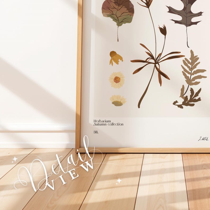 May include: A framed botanical print with pressed autumn leaves and flowers. The print is titled "Herbarium Autumn Collection" and is dated 2021. The print is displayed on a light wood floor.