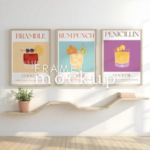May include: Three framed illustrations of cocktails, each with a different name and a colourful illustration of the drink. The names are "Bramble", "Rum Punch", and "Penicillin".