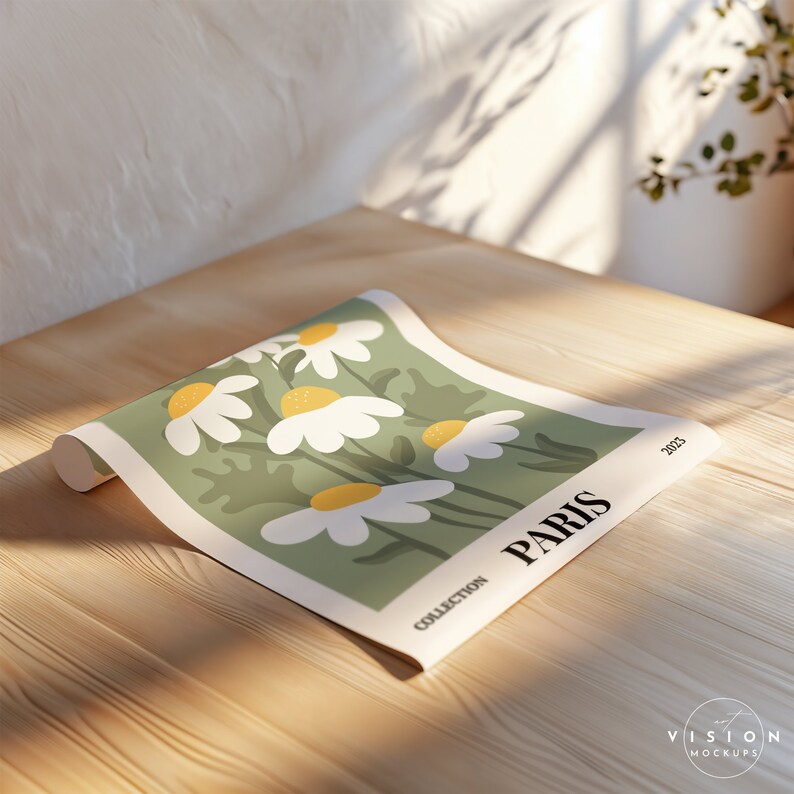 May include: A rolled up poster with a green background and white daisies with yellow centers. The poster has the text "COLLECTION PARIS 2023" at the bottom.