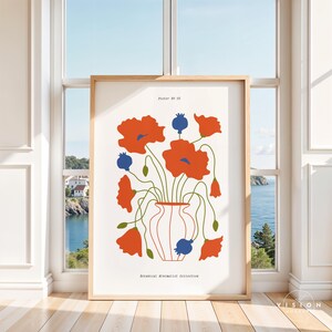 May include: A poster with a minimalist design featuring a vase of red poppies with blue centers. The text "Poster No. 03" and "Botanical Minimalist Collection" is printed at the top and bottom of the poster.