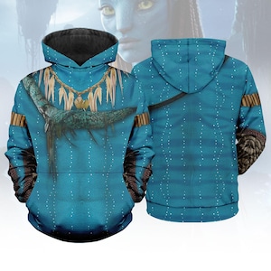 May include: A blue hoodie featuring a design inspired by the movie Avatar. The front displays a detailed graphic of a tribal necklace and a creature, with white dot patterns. The sleeves have a brown and black pattern, and the hood is lined with black.
