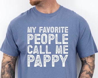 May include: A blue t-shirt with the text "My Favorite People Call Me Pappy" in white lettering.