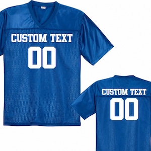 May include: A royal blue V-neck jersey with short sleeves and a mesh texture. The front and back feature the white text CUSTOM TEXT above the white number 00 in a block font. The design is shown from both the front and back perspectives.