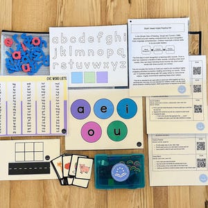 May include: A set of educational materials for teaching short vowel sounds. The set includes a variety of items, such as flashcards, word lists, and a magnetic board. The materials are designed to help children learn to recognize and pronounce the short vowel sounds.