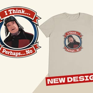 May include: A light beige t-shirt featuring a cartoon image of a man in a hat, with the text "I Think... Perhaps... No" in a red banner. A matching graphic is on the left. A red banner at the bottom reads "NEW DESIGN!"