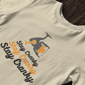 Stay Cranky, Funny Fishing Unisex Softstyle T-Shirt, Unique Fishing gift for Him/Her, Bass Salmon Walleye Fishing Shirt, Outdoors Gift