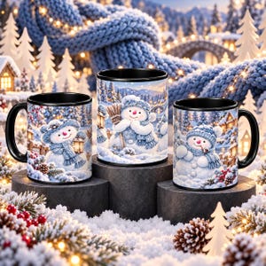 May include: Three black ceramic mugs featuring a winter scene with snowmen wearing blue hats and scarves. The mugs display a snowy landscape with pine trees, a bridge, and warm glowing lights, creating a festive holiday atmosphere on each cup.