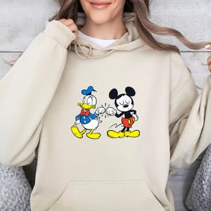 Disney Mickey Mouse and Donald Duck Best Friends Hoodie, Disneyland Matching Hoodie, Mickey Sweater, Mickey friend Shirt, Gift For bestie
Disney hoodie
Hooded Sweater
magic kingdom tee
disneyland family
matching shirt
disney mickey mouse
donald duck
best friends gift
mickey and friends
birthday gifts
retro mickey
disney trip
gift for bestie