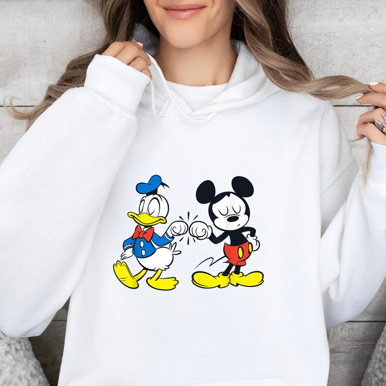 Disney Mickey Mouse and Donald Duck Best Friends Hoodie, Disneyland Matching Hoodie, Mickey Sweater, Mickey friend Shirt, Gift For bestie
Disney hoodie
Hooded Sweater
magic kingdom tee
disneyland family
matching shirt
disney mickey mouse
donald duck
best friends gift
mickey and friends
birthday gifts
retro mickey
disney trip
gift for bestie