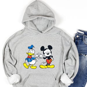 Disney Mickey Mouse and Donald Duck Best Friends Hoodie, Disneyland Matching Hoodie, Mickey Sweater, Mickey friend Shirt, Gift For bestie
Disney hoodie
Hooded Sweater
magic kingdom tee
disneyland family
matching shirt
disney mickey mouse
donald duck
best friends gift
mickey and friends
birthday gifts
retro mickey
disney trip
gift for bestie