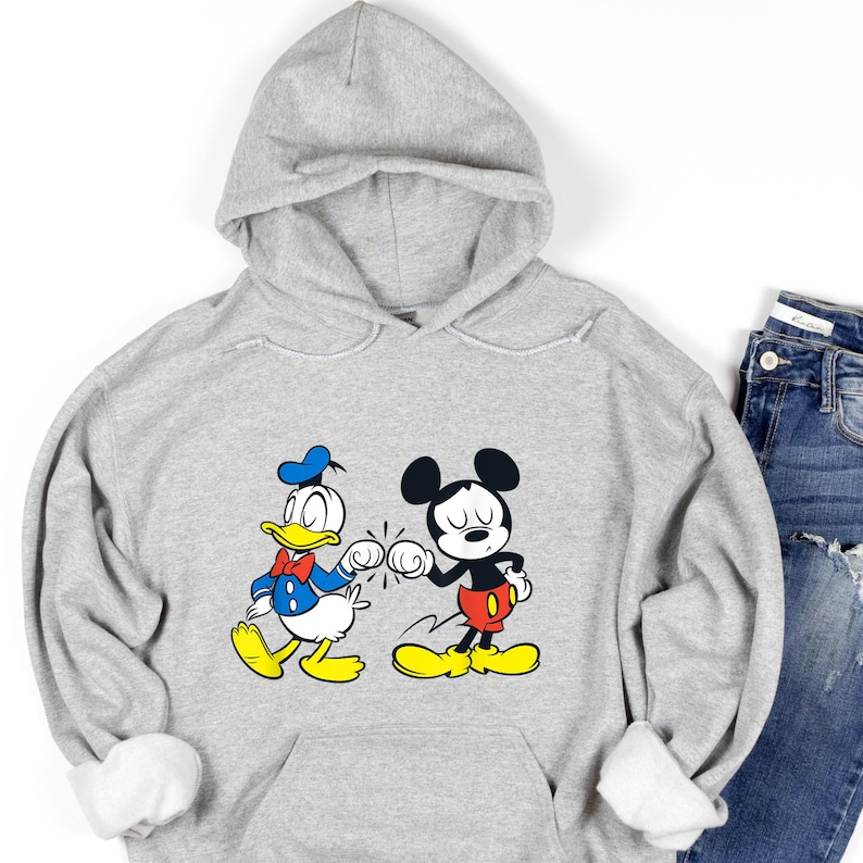 Disney Mickey Mouse and Donald Duck Best Friends Hoodie, Disneyland Matching Hoodie, Mickey Sweater, Mickey friend Shirt, Gift For bestie
Disney hoodie
Hooded Sweater
magic kingdom tee
disneyland family
matching shirt
disney mickey mouse
donald duck
best friends gift
mickey and friends
birthday gifts
retro mickey
disney trip
gift for bestie