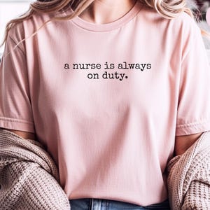 Not Your Problem Nurse Meme Shirt | 'A Nurse Is Always On Duty' Sarcastic RN Tee | Hospital Humor Registered Nurse Gift, Medical Quote image 4