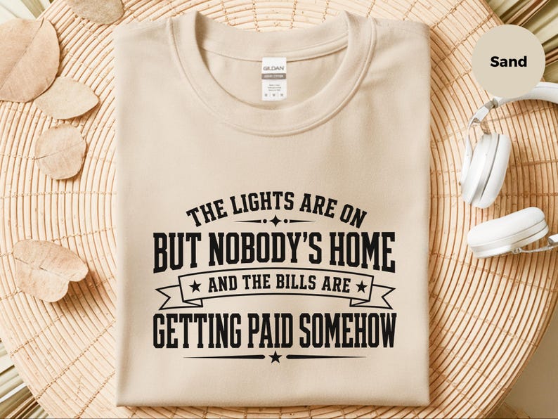 Funny Adult Humor Shirt, Sarcastic Adulting Tee, The Lights Are On But Nobody's Home and Bills Are Getting Paid Somehow, Gen X Gift image 1