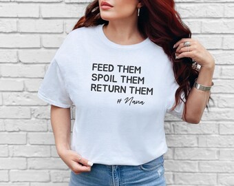 May include: A white short-sleeved t-shirt featuring black text that reads FEED THEM SPOIL THEM RETURN THEM # Nana. The shirt has a crew neckline and a standard fit, providing a clean and simple look for casual wear in any setting.