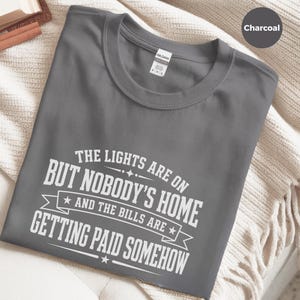 Funny Adult Humor Shirt, Sarcastic Adulting Tee, The Lights Are On But Nobody's Home and Bills Are Getting Paid Somehow, Gen X Gift image 6