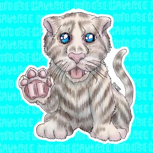 May include: A white tiger cub with gray stripes sits on a light blue background. The cub has blue eyes and is waving with its right paw. The cub has a pink nose and tongue sticking out.