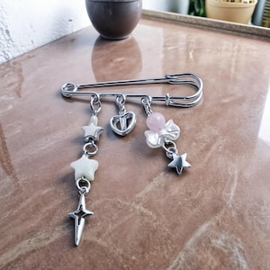 Silver Celestial Charms Safety Pin Brooch – Pastel Stars, Hearts, and Bow Accent