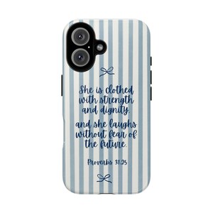May include: A phone case with a blue and white striped pattern. The case features the text "She is clothed with strength and dignity, and she laughs without fear of the future. Proverbs 31:25" in a handwritten font.