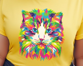 May include: A yellow t-shirt with a colorful abstract cat design. The cat has blue eyes and a white nose.