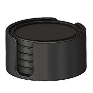 May include: A set of black coasters stacked together in a holder. The holder is made of a dark material and has a smooth, rounded surface.