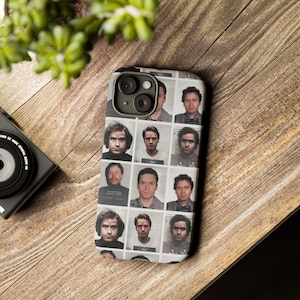 May include: A black phone case featuring a collage of mugshots of men. The case has a camera lens cutout in the top left corner.