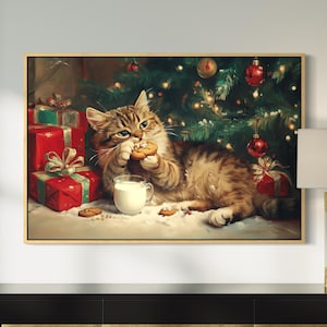 May include: A framed print shows a tabby cat eating a biscuit and drinking milk near a Christmas tree. Red gift boxes with bows and baubles are in the background. The artwork has a warm, inviting feel, ideal for festive decor.