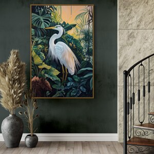 This canvas print captures a majestic heron standing amidst lush tropical foliage, illuminated by a soft, golden sunrise. Its detailed portrayal and vibrant setting make it a striking piece for any nature or bird enthusiast's collection.