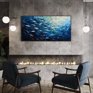 A dynamic school of fish swims in unison through the tranquil blue sea, their silvery scales reflecting light, depicted with thick, textured brushstrokes that give life and movement to this captivating marine scene.