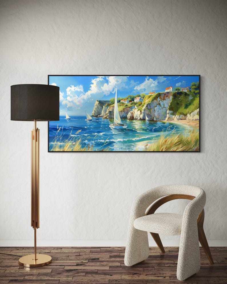 Sailboats glide on azure waters near chalky cliffs with green tops under a vast, cloud-dappled sky, portraying a serene, sunlit seascape.