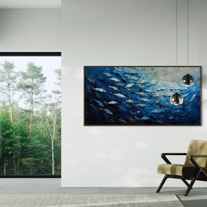 A dynamic school of fish swims in unison through the tranquil blue sea, their silvery scales reflecting light, depicted with thick, textured brushstrokes that give life and movement to this captivating marine scene.