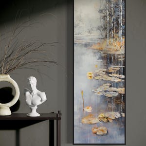 This serene painting features a tranquil pond with lily pads and birch trees. The soft, muted colors and delicate details create a peaceful, reflective scene, perfect for adding a touch of nature and calm to any space.