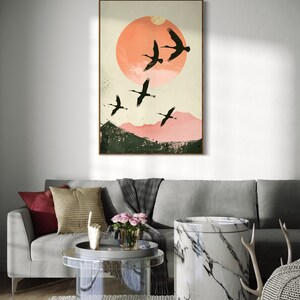 Silhouettes in Flight: A serene composition featuring cranes soaring across a textured pink sunset, their graceful forms framed against a full moon.