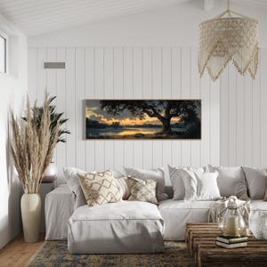 Capturing the tranquil essence of dusk, this panoramic artwork features a majestic oak tree overlooking a serene river, illuminated by the golden hues of a setting sun.