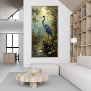 A serene Blue Heron stands amidst a lush wetland oasis, its graceful form bathed in dappled sunlight filtering through a verdant canopy. Perfect for a tranquil decor piece.