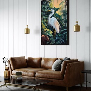 This canvas print captures a majestic heron standing amidst lush tropical foliage, illuminated by a soft, golden sunrise. Its detailed portrayal and vibrant setting make it a striking piece for any nature or bird enthusiast's collection.