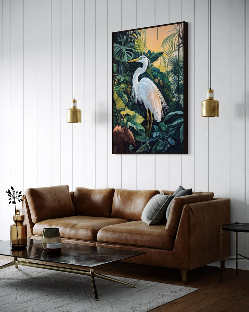 This canvas print captures a majestic heron standing amidst lush tropical foliage, illuminated by a soft, golden sunrise. Its detailed portrayal and vibrant setting make it a striking piece for any nature or bird enthusiast's collection.