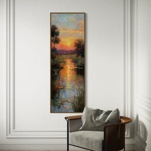 Impressionist landscape art of a glowing sunset over a peaceful waterway with lily pads and tall grasses. The golden light reflects on the calm water, surrounded by soft trees and vibrant colors. A serene nature scene perfect for rustic, cottage, or lake house decor.