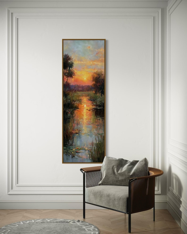 Impressionist landscape art of a glowing sunset over a peaceful waterway with lily pads and tall grasses. The golden light reflects on the calm water, surrounded by soft trees and vibrant colors. A serene nature scene perfect for rustic, cottage, or lake house decor.