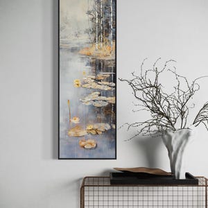 This serene painting features a tranquil pond with lily pads and birch trees. The soft, muted colors and delicate details create a peaceful, reflective scene, perfect for adding a touch of nature and calm to any space.