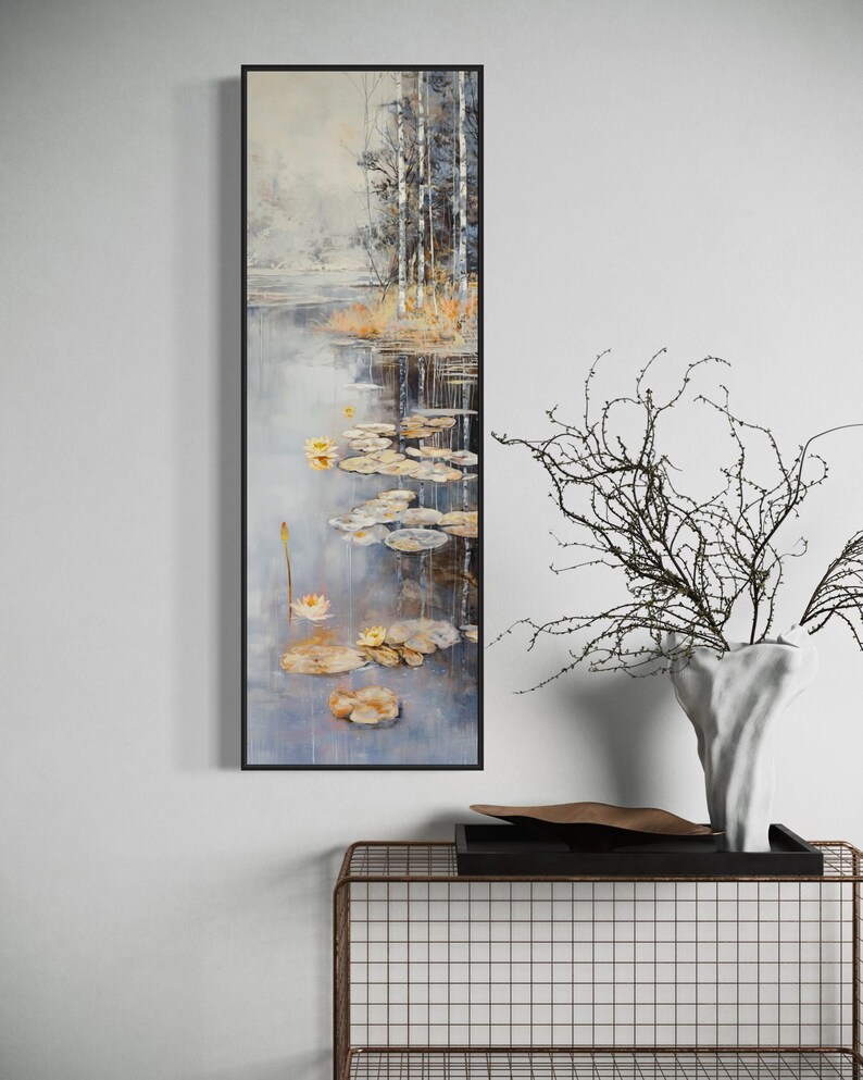 This serene painting features a tranquil pond with lily pads and birch trees. The soft, muted colors and delicate details create a peaceful, reflective scene, perfect for adding a touch of nature and calm to any space.