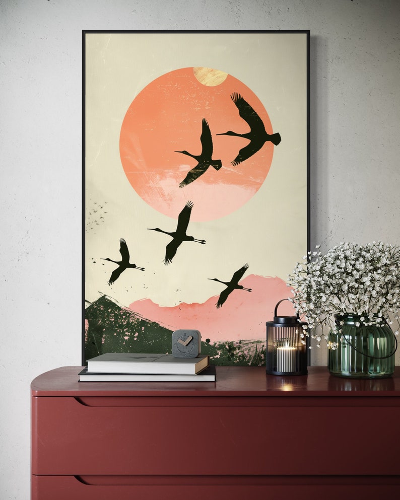 Silhouettes in Flight: A serene composition featuring cranes soaring across a textured pink sunset, their graceful forms framed against a full moon.