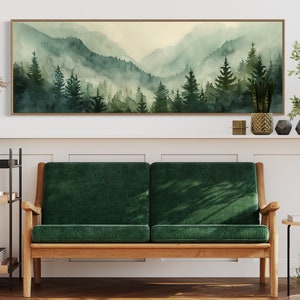 Misty Mountain Serenity: A dreamy vista where lush evergreens pierce through the soft veil of morning mist, creating layers of tranquil beauty.