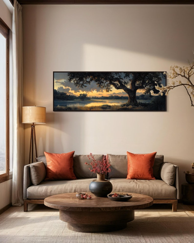 Capturing the tranquil essence of dusk, this panoramic artwork features a majestic oak tree overlooking a serene river, illuminated by the golden hues of a setting sun.