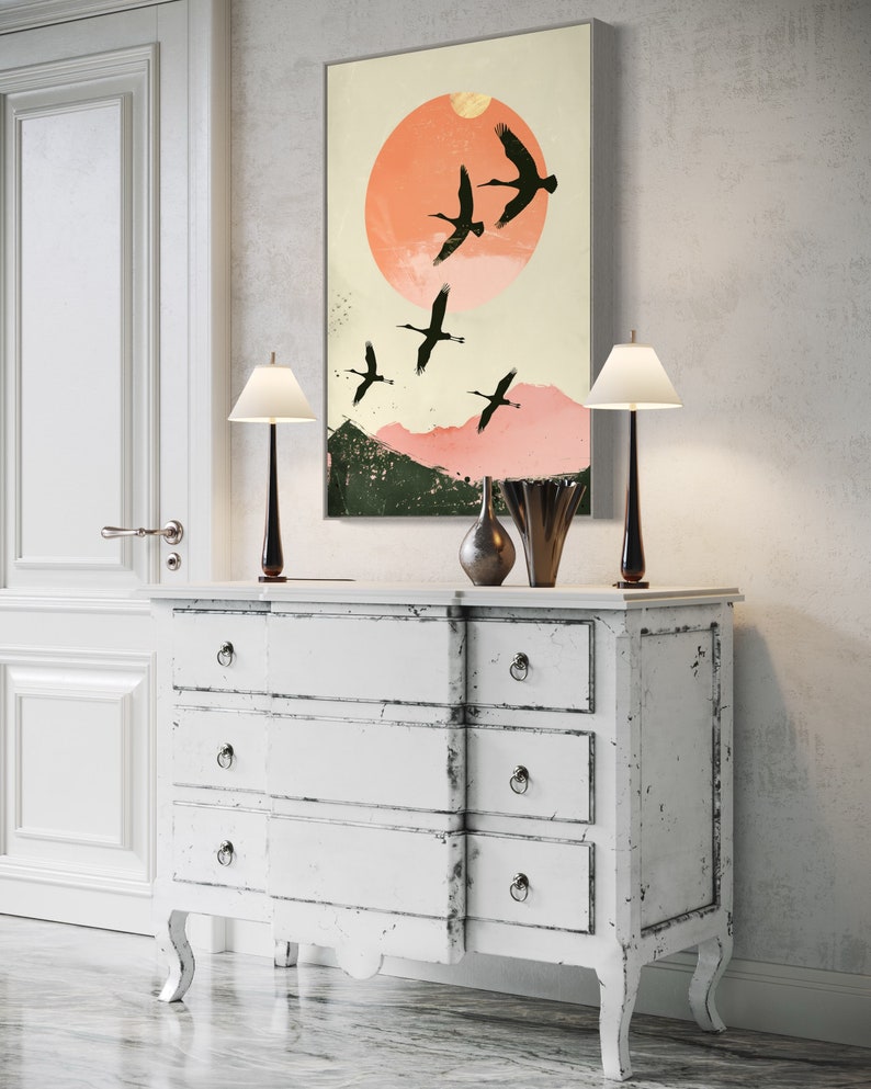 Silhouettes in Flight: A serene composition featuring cranes soaring across a textured pink sunset, their graceful forms framed against a full moon.