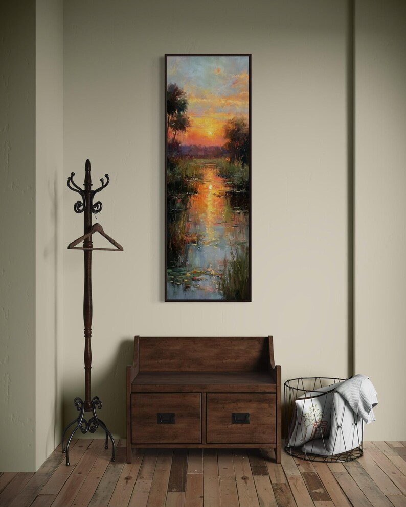 Impressionist landscape art of a glowing sunset over a peaceful waterway with lily pads and tall grasses. The golden light reflects on the calm water, surrounded by soft trees and vibrant colors. A serene nature scene perfect for rustic, cottage, or lake house decor.