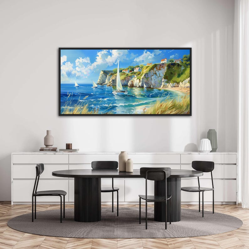 Sailboats glide on azure waters near chalky cliffs with green tops under a vast, cloud-dappled sky, portraying a serene, sunlit seascape.