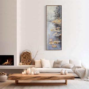 This serene painting features a tranquil pond with lily pads and birch trees. The soft, muted colors and delicate details create a peaceful, reflective scene, perfect for adding a touch of nature and calm to any space.